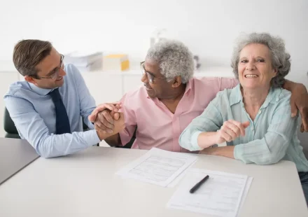 Older adults discussing care plans at a table