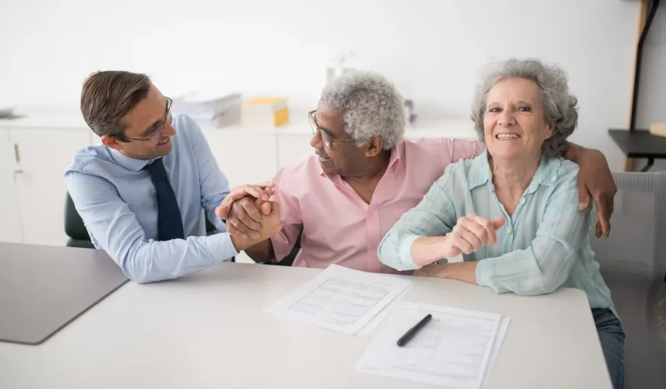 Older adults discussing care plans at a table