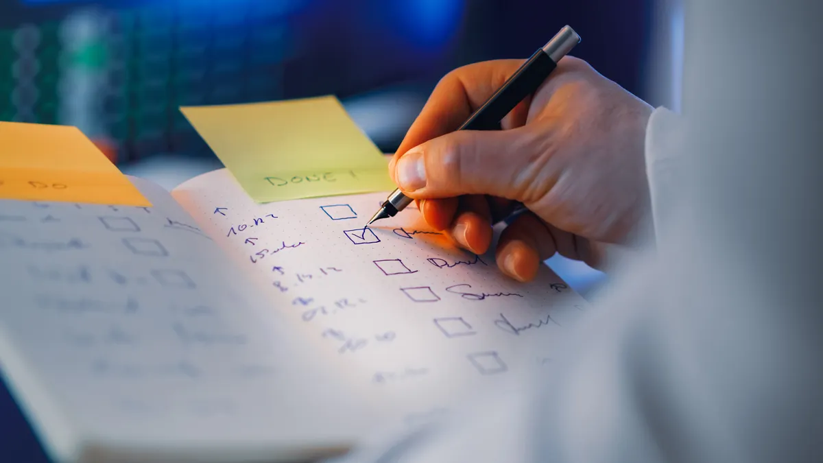 How to set up a backup care plan when your main caregiver is unavailable Hand ticking off a checklist on paper