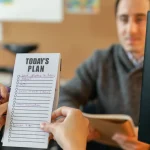 Checklist and sticky note suggesting a care plan list